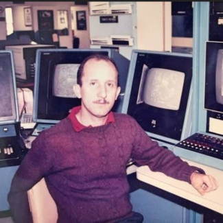 Lixion Avila seated at AFOS stations in 1988.