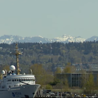NOAA ship in front of NOAA Western Regional Center
