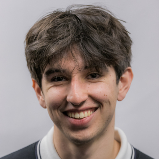 A headshot of Conrad Avila.