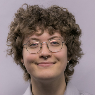 A headshot of Emma Barrett.