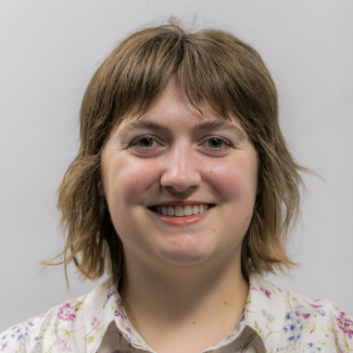 A headshot of Andie Forbes.