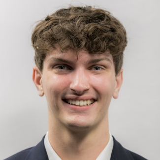 A headshot of Mitchell Foster.