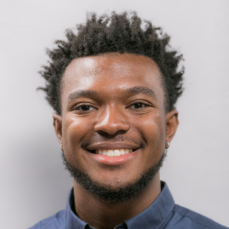 A headshot of Malik Hall.