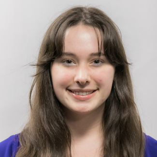 A headshot of Cora Jackson.