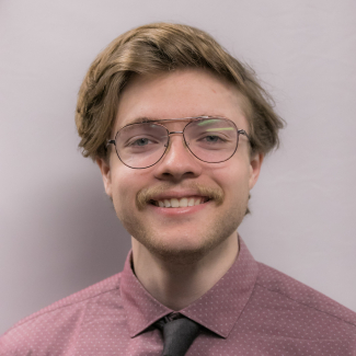 A headshot of Caleb Jansen.