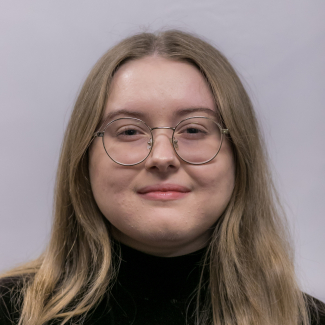 A headshot of Grace McCoy.