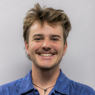 A headshot of Justin Osborne.