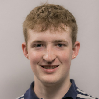 A headshot of Andrew Price.