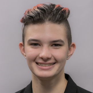 A headshot of Sasha Renton.