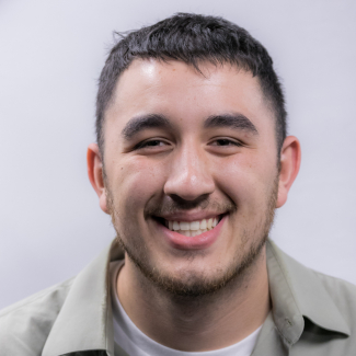 A headshot of Alex Rojas.