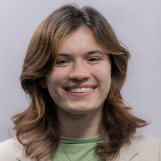 A headshot of Mikaela Serio.