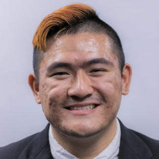 A headshot of Liam Thompson.