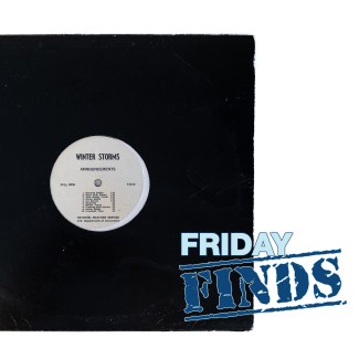 A vinyl record labeled, “Winter Storms Announcements,” in a plain black sleeve.